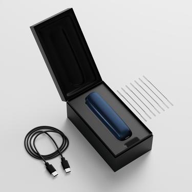 Ploom AURA open box showing the device, its charging cable and cleaning sticks.