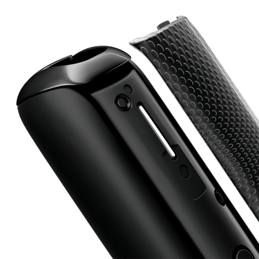 Close-up of Jet Black Augmented Pattern Ploom AURA front panel, detached from device.
