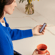 Woman holding a Ploom device with Lavender Front Panel