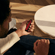 Man holding a Ploom device with Lava Red Front Panel