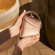 Hand holding a Ploom Duo Carry Case Rose Gold accessory