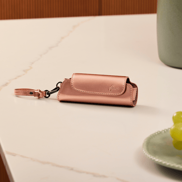 Ploom AURA Rose Gold Solo Carry Case accessory on a table