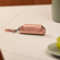 Ploom AURA Rose Gold Solo Carry Case accessory on a table