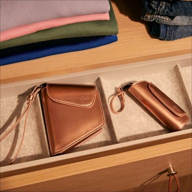 Ploom AURA Rose Gold Solo and Duo Carry Case accessories in a drawer
