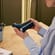 User opening a Ploom Solo Carry Case Denim Leather Fusion accessory