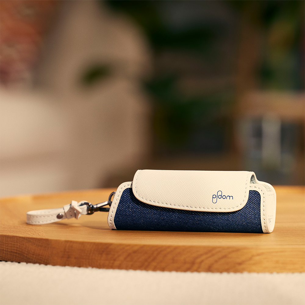 Ploom AURA Denim Leather Fusion Solo Carry Case accessory on a table
